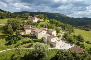 an aerial view of a village in the hills at Castello di Gallano Resort in Valtopina