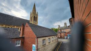 a view of a church with a clock tower at Heart of Lincoln City 3 bedrooms sleeps 4 guests in Lincoln