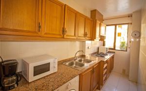 Køkken eller tekøkken på Primera línea Playa Cargador - Playamar 1012 ALBERT VILLAS