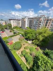 a view of a park in a city with buildings at Lovely home - Free parking in Budapest