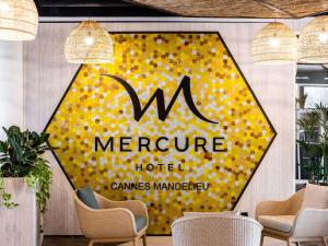 a sign for a morgue hotel with yellow polka dots at Mercure Cannes Mandelieu in Cannes