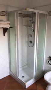 a shower with a glass door in a bathroom at Agriturismo Genovesi in Alvignano