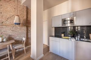 Kuchyňa alebo kuchynka v ubytovaní Apartamentos Líbere Málaga Teatro Romano