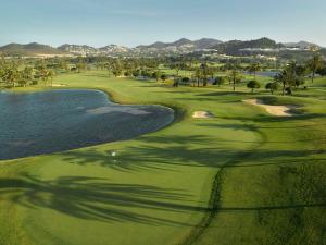 an aerial view of a golf course with palm trees at Grand Hyatt La Manga Club Golf & Spa in La Manga del Mar Menor