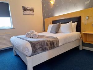 The Mill Forge Hotel客房内的一张或多张床位