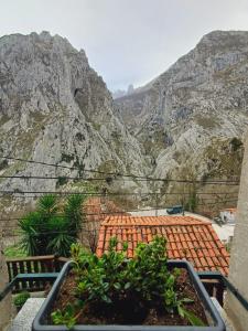 a balcony with a view of a mountain at El Portal del Abuelo in Arenas de Cabrales