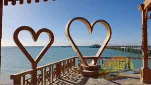 a couple of heart shaped sculptures on a pier at Orange Bay in Hurghada