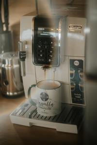 Coffee and tea making facilities at Vass Villa Vendégház és Pincészet Felsőörs
