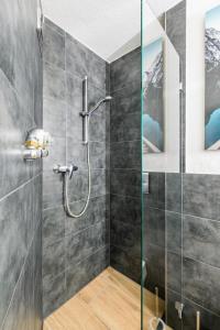 a shower with a glass door in a bathroom at Studio Apart - Küche - Balkon - Netflix in Bad Säckingen