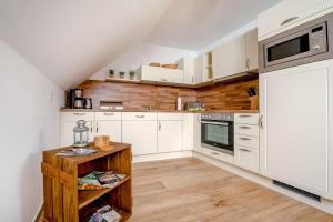 Kuchyň nebo kuchyňský kout v ubytování Ferienwohnung Heuschober