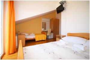 Postel nebo postele na pokoji v ubytování Guest House Lav