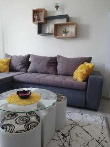a living room with a couch and a table at Apartman Djokic 3 in Požarevac