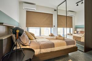 Postel nebo postele na pokoji v ubytování Garden View 9 - Two Bedroom Apartment