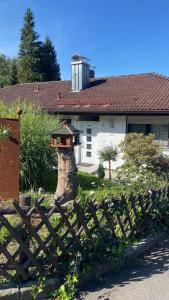 a wooden fence in front of a house at Ferienhaus Alexandra in Thyrnau in Thyrnau