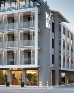 an exterior view of a building with the number on it at 1910 Lifestyle Hotel in Volos