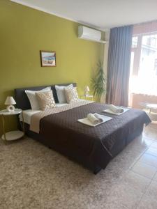 A bed or beds in a room at Guest House Pomorie