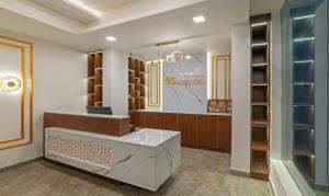 a dressing room with a counter and a mirror at Treebo Trend Global Stay Jayanagar in Bangalore