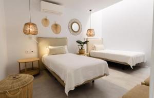 מיטה או מיטות בחדר ב-Alma Suite Duplex
