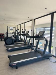 a row of treadmills in a gym with windows at Serena Village Tulear in Toliara