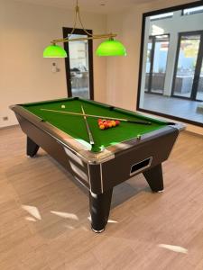 a pool table with balls on it in a room at Serena Village Tulear in Toliara