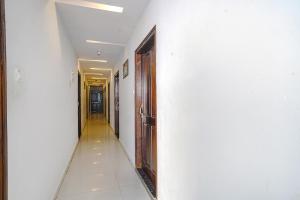 an empty hallway with a door and a hallwayngth at FabHotel Hamsa The Right Choice in Hyderabad