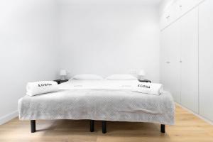 Łóżko lub łóżka w pokoju w obiekcie Egona - Zi28 Centro de Zarautz, Reformada-Luminosa