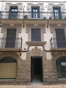 an apartment building with a balcony and a door at Egona - Zi28 Centro de Zarautz, Reformada-Luminosa in Zarautz