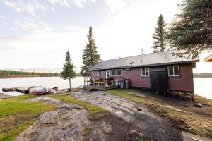 a small house on the shore of a lake at South McInnes in Red Lake