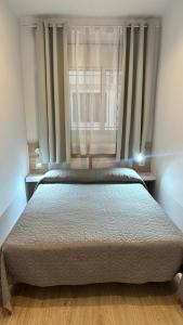 Posteľ alebo postele v izbe v ubytovaní Apartsalou Tati