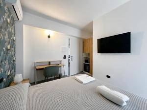 Телевизор и/или развлекательный центр в Pinea b&b
