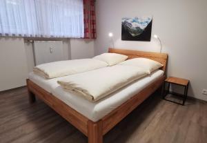 Postel nebo postele na pokoji v ubytování Montana Haus, Fewo A14, A17, B4 oder C8