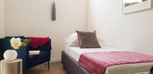 A bed or beds in a room at Le Stanze Di Catia