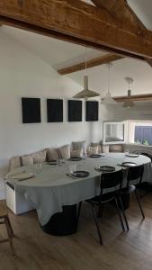 a dining room with a large table and chairs at Casa Familia in La Teste-de-Buch