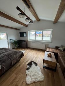 a bedroom with a dog laying on the floor at Cityapartments Reutte in Reutte