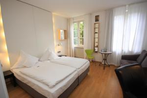 Postel nebo postele na pokoji v ubytování Hotel am Main