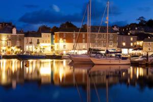 a group of boats docked in a marina at night at No 10 The Towans in St Merryn