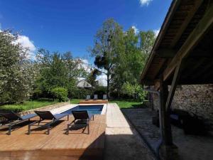 a patio with chairs and a swimming pool at MAISONS - SAUNA, HAMMAN ET PISCINE. FÊTES INTERDIT in Saint-Barthélemy