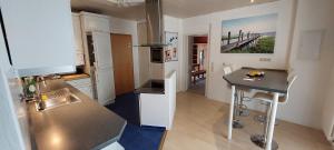 a kitchen with a sink and a counter top at MW Ferienwohnung Höxter Weserbergland an der Weser in Höxter