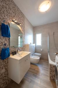 a bathroom with a sink and a toilet and a mirror at HAPPY DAYS in Trogir +86 photos