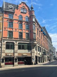 a large building on a city street with at P-Hotels Oslo in Oslo