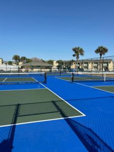 a couple of tennis courts with at The Nest Egg in Panama City Beach