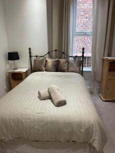 מיטה או מיטות בחדר ב-Rock Lane Rooms