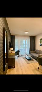 Coin salon dans l'établissement REMAR - Apartamenty z widokiem na Jezioro Biale