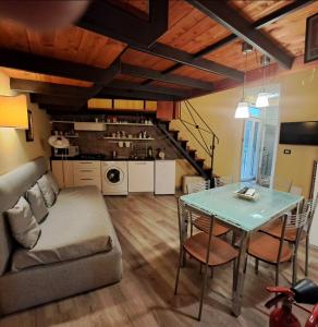 a living room with a table and a couch at Guide Tour Apartments in Naples