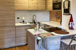 a kitchen with a counter with a blender on it at Chalet Erika: che vista! in San Martino di Castrozza
