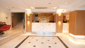 a lobby with a reception desk in a building at Dosso Dossi Hotels Old City in Istanbul