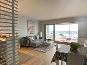 Et opholdsområde på Très bel appartement de 55 m2 face mer avec superbe vue sur la baie de la Baule