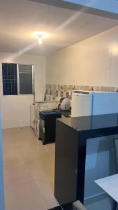 Kuchyň nebo kuchyňský kout v ubytování Adonai Campos dos Goytacazes parque rodoviário