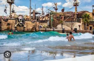 two people playing in the water at a water park at Mobil home les sables d'or in Cap d'Agde