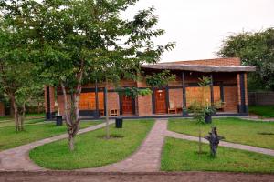 a brick building with a statue in front of it at KUDU SAFARI LODGE (Mfuwe, Zambia) in Mfuwe